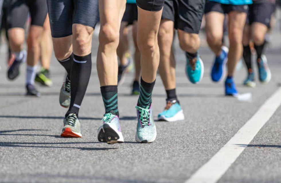 legs of a group of runners at the hamburg marathon legs of a group of runners at the hamburg marathon