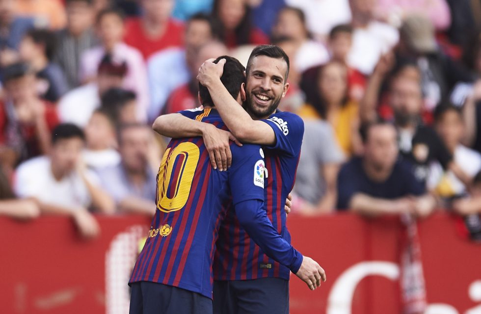 SEVILLE, SPAIN - FEBRUARY 23: Lionel Messi of FC Barcelona celebrates with his teammates Jordi Alba of FC Barcelona after scoring his team's third goal during the La Liga match between Sevilla FC and FC Barcelona at Estadio Ramon Sanchez Pizjuan on February 23, 2019 in Seville, Spain. (Photo by Aitor Alcalde/Getty Images)
